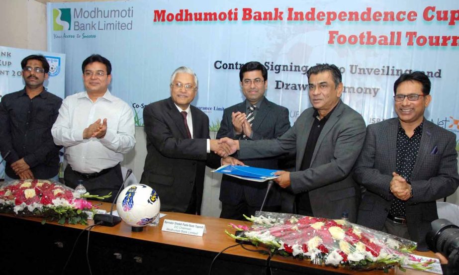 President of Bangladesh Football Federation (BFF) Kazi Md Salahuddin and Managing Director & CEO of Modhumoti Bank Limited Md Mizanur Rahman shaking hands after signing the Memorandum of Understanding (MoU) between BFF and Modhumoti Bank Limited at the co