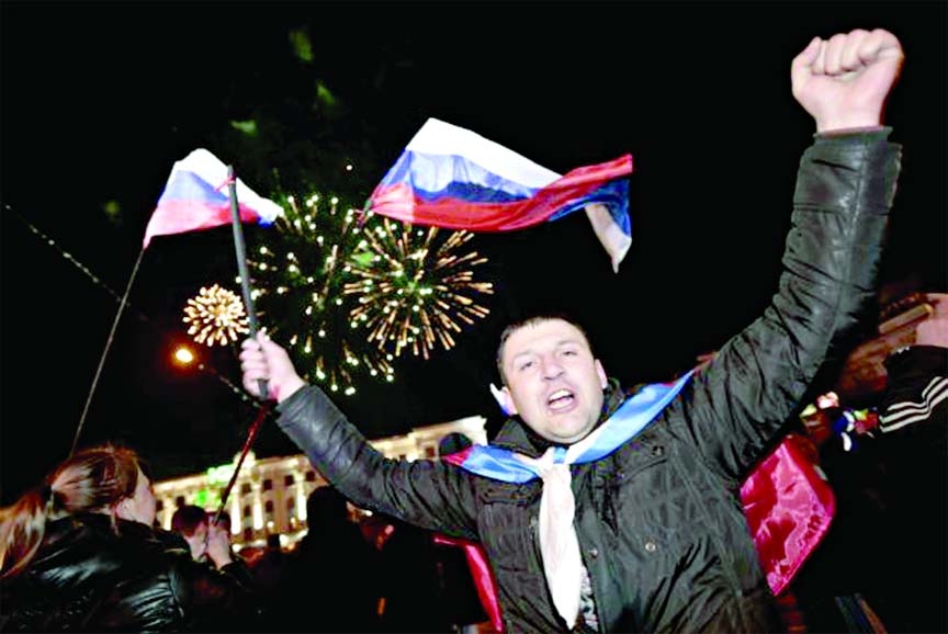 Pro-Russians are celebrating in Crimea Sunday night after the region overwhelmingly voted in favour of splitting from Ukraine and rejoining Russia.