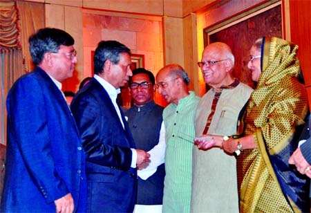 Prime Minister Sheikh Hasina receives a cheque of Tk 1crore from former Chairman and Sponsor Shareholder ATM Hayatuzzaman Khan and former Chairman and Director Altaf Hossain Sarker of Dhaka Bank for 'Lakho Konthe Sonar Bangla' fund recently.