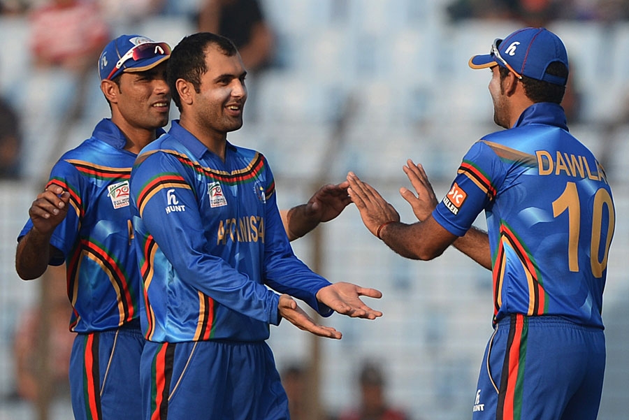 Mohammad Nabi celebrates a wicket with his team-mates during World T20, Group A match between Afghanistan and Hong Kong in Chittagong on Tuesday.