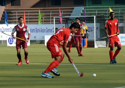 An action from the match of the Islami Bank Asian Games Hockey Qualifying Tournament between Oman and Qatar at the Moulana Bhashani National Hockey Stadium on Wednesday.