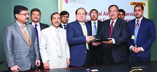 Desmond Quiah, Country Manager of DHL Express Bangladesh and M Fakhrul Alam Managing Director, One Bank Limited exchange documents after signing an agreement on behalf of their respective organizations recently.