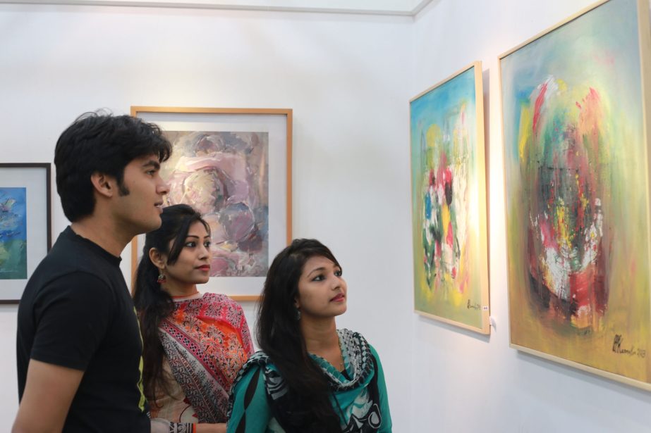 Visitors enjoy artworks of Bipad Bhanjan Karmaker at La Galerie of Alliance Francaise de Dhaka in opening day of the exhibition