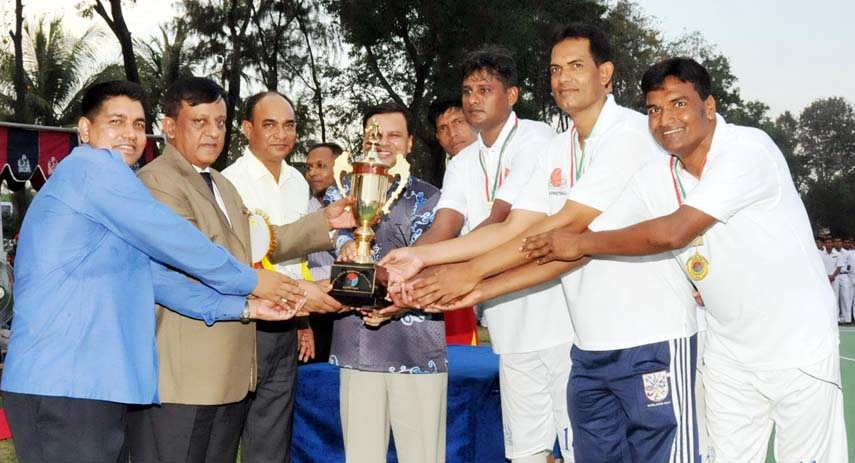 GOC of 24th Infantry Division of Bangladesh Army and Area Commander of Chittagong Major General Sabbir Ahmed handing over the trophy to Bangladesh Navy team, which became champions in the Inter-Service Basketball Tournament in Chittagong on Thursday.