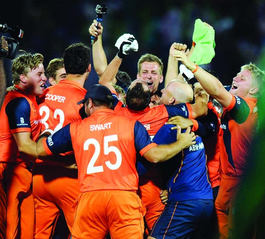 Netherlands' players celebrate after qualifying for the Super 10 stage beating Ireland in World T20, First Round Group B match in Sylhet on Friday.