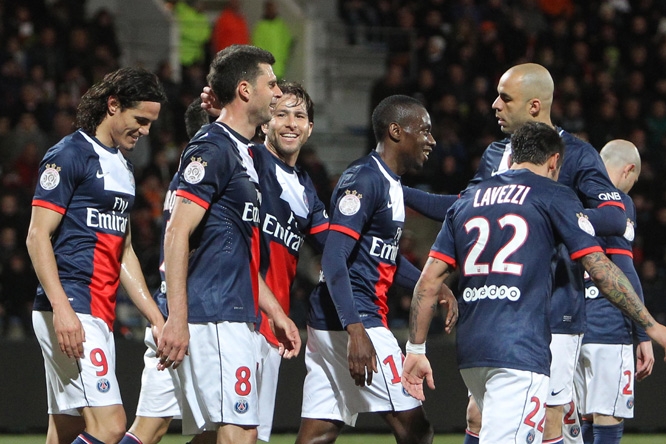 Paris Saint Germain's midfielder Thiago Motta, second left, is congratulated by teammates after scoring the first goal during their French League one soccer match, in Lorient, western France, Friday, March 21, 2014.