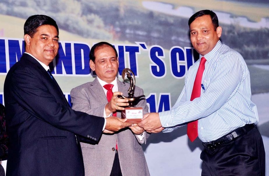 Deputy Minister for Forest and Environment Abdullah Al Islam Jacob handing over prizes among the winners of the NDC-Janik Commandant's Cup Golf Tournament at the National Defence College Auditorium in Mirpur Cantonment on Saturday.