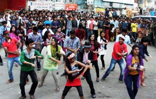 Students of the Atish Dipankar University of Science & Technology present a show on Saturday namely ICC T-20 World Cup Flash Move with a song dubbed as "Char CHokka Hoi Hoi"" at the university Panthapath campus in the capital."