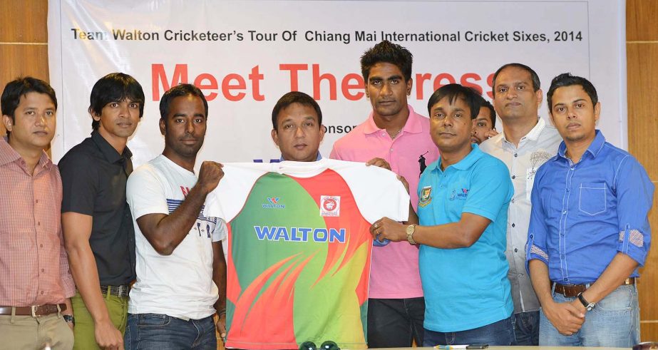 Cricketer Elias Sunny (3rd from left), Director of BCB Khaled Mahmud Sujan (4th from left) and Operative Director of Walton Uday Hakim (3rd from right) pose with the jersey of Walton Cricketers at the conference room of Bangabandhu National Stadium on Tue