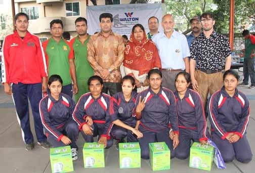 Bangladesh Police, the champions of the women's division of the Independence Day Walton Refrigerator Open Wrestling Competition with the officials of Bangladesh Amateur Wrestling Federation pose for a photograph at the Kabaddi Stadium on Wednesday.