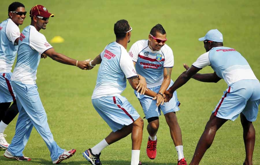 West Indies players share a light moment during a training session at Mirpur on Thursday. West Indies meet Australia today.