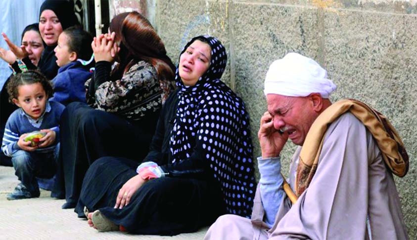 Relatives outside the courthouse in the southern province of Minya in Egypt react to news of the death sentence of 269 Mursi supporters on March 24.