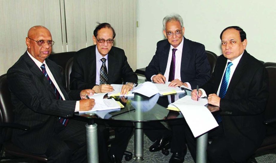 ONE Bank's Vice Chairman Asoke Das Gupta, Directors Salahuddin Ahmed, Syed Nurul Amin, and Managing Director M Fakhrul Alam seen signing the Audited Financial Statements of the bank for the year ended December 31, 2013.