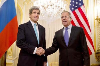 US. Secretary of State John Kerry (L) shakes hands with Russian Foreign Minister Sergei Lavrov before their meeting at the Russian Ambassador's residence in Paris on Sunday. Kerry and Lavrov met.