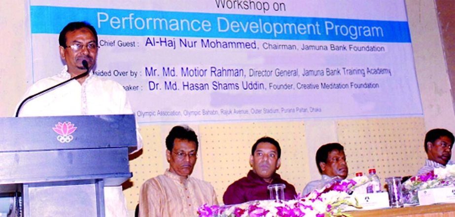 Nur Mohammed, Chairman of Jamuna Bank Foundation, inaugurating a workshop on "Performance Development Program" organized by Jamuna Bank Training Academy at a city auditorium recently. Md Motior Rahman, Director General of Jamuna Bank Training Academy pr
