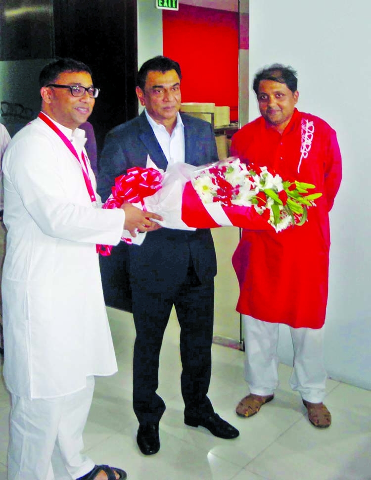 Representative of Robi Axiata Company accords a reception to President of South Asian Football Federation (SAFF) and President of BFF Kazi Md Salahuddin at the office room of Robi in Gulshan on Monday.