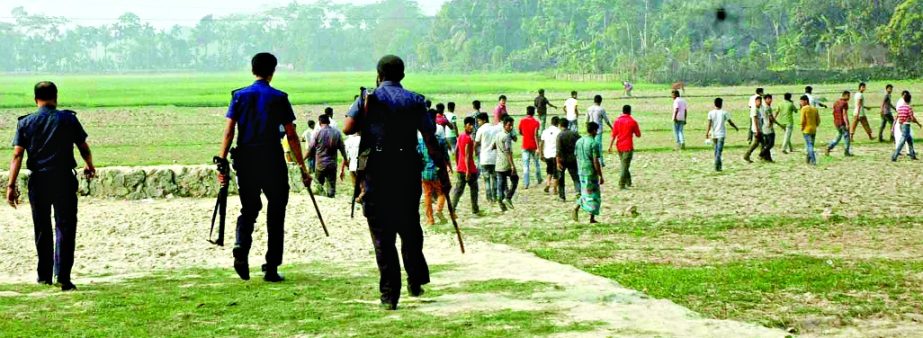 Police chasing persons trying to create violence at Banshpara Etimkhana polling centre during 5th phase of UZ election on Monday.