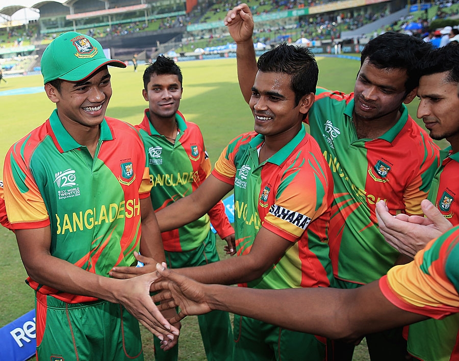 Taskin Ahmed is congratulated after getting his international cap during the World T20, Group 2 match between Bangladesh and Australia at Mirpur on Tuesday.