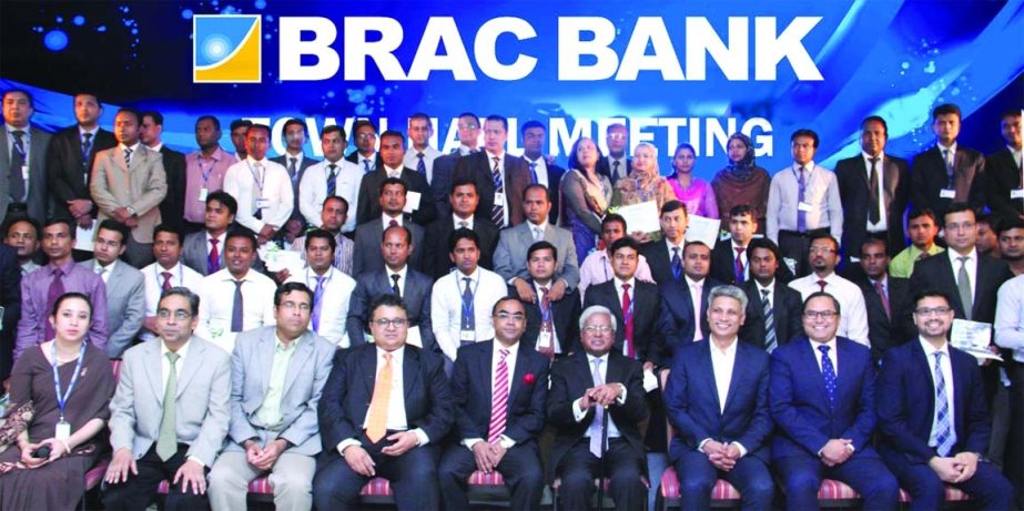 Fazle Hasan Abed, Chairperson and Syed Mahbubur Rahman Managing Director of BRAC Bank pose with the award winners employees of the bank at Town Hall Meeting in the city recently.