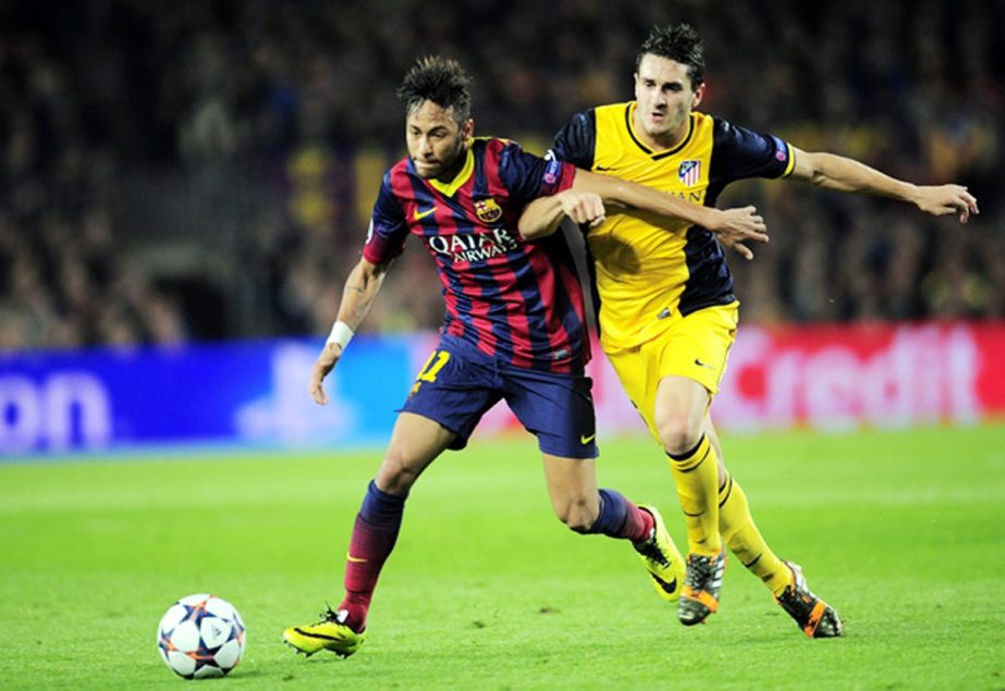 Barcelona's Neymar (left) holds off Atletico's Koke during a first leg quarterfinal Champions League soccer match between Barcelona and Atletico Madrid at the Camp Nou Stadium in Barcelona, Spain on Tuesday.