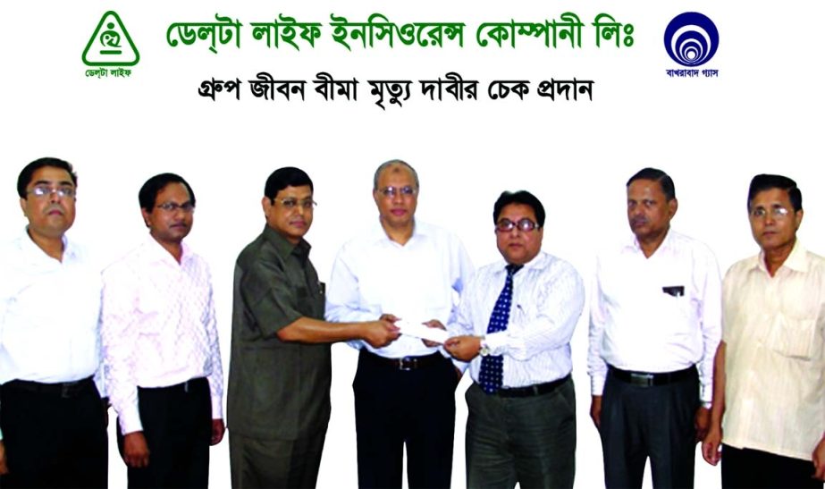 Uttam Kumar Shadhu, Deputy Managing Director of Delta Life Insurance Company Ltd handing over a death claim cheque of Md Iakub Ali former Manager of the company of Tk 31,25,000 to Md Mahfuz Haque, General Manager (Administration) of Bakhrabad Gas Distribu