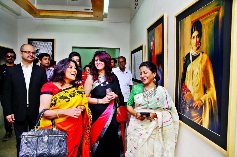 Visitors enjoying photographs at inaugural ceremony of bridal fashion photography exhibition at Gallery Chitrak on Thursday