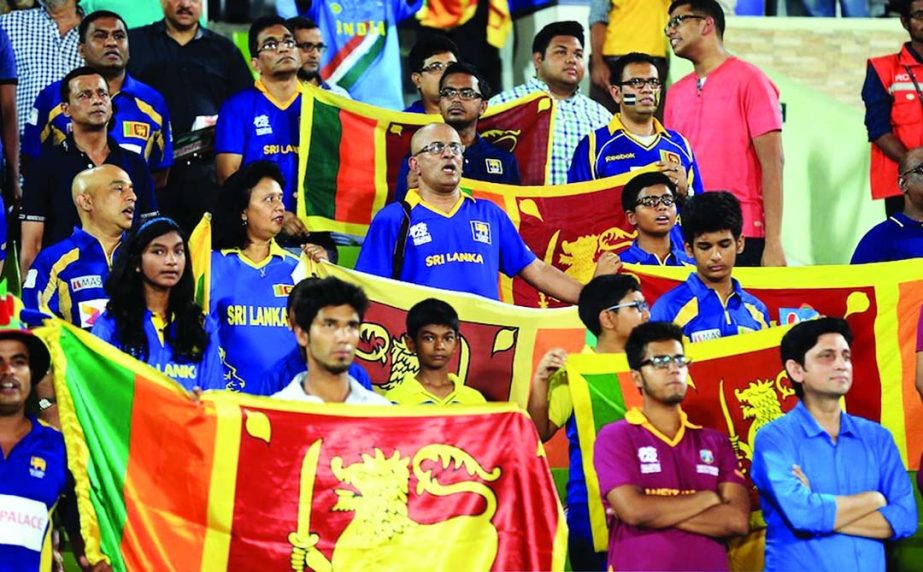 Sri Lankan fans sing the national anthem during the ICC World Twenty20 semi final match between Sri Lanka and the West Indies at Sher-e-Bangla Cricket Stadium, Mirpur on Thursday.