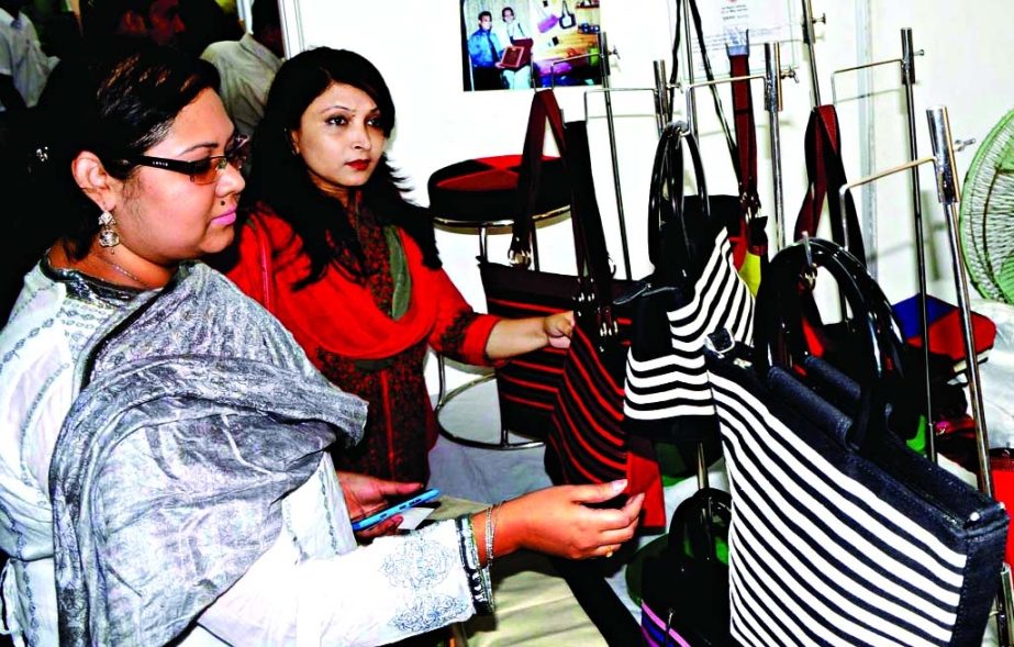 Choose and Pick: Customers at a stall in the ongoing 3rd National SME Fair-2014 at the Bangabandhu International Conference Centre on Friday.