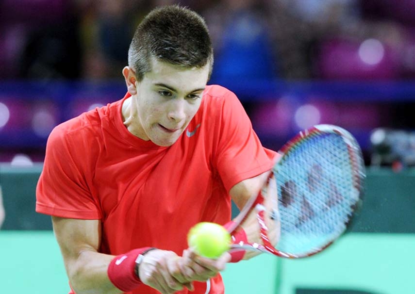 Croatia's Borna Coric returns the ball to Poland's Jerzy Janowicz during their Davis Cup Group I second round tennis match in Warsaw Poland on Friday.