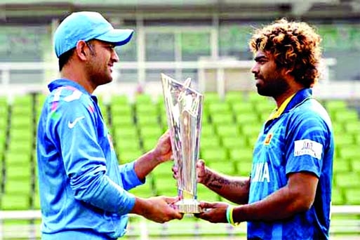 WHO WILL WIN THE CUP? Indian Captain Mahendra Singh Dhoni and his Lankan Captain Lasith Malinga pose with the ICC Twenty20 trophy on Saturday.