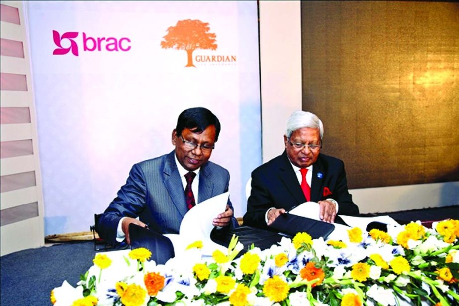 Fazle Hasan Abed, Founder and Chairman of Brac Group and Noor Mohammed Bhuiyan, Managing Director of Guardian Life Insurance Limited sign a contract to provide Group Life Insurance coverage to all employees of Brac Group at Bangabandhu International Conf