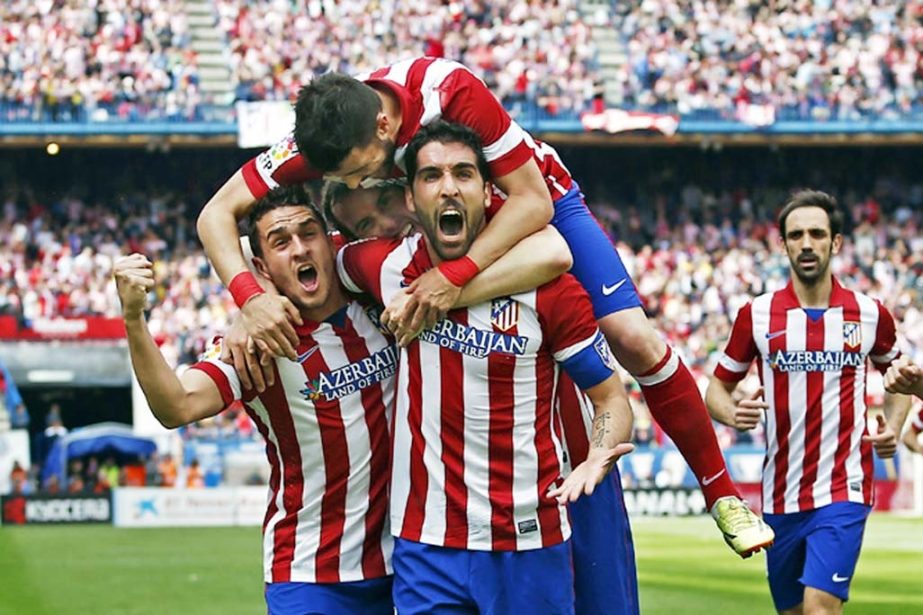 Atletico's Raul Garcia center right celebrates his goal with teammates during a Spanish La Liga soccer match between Atletico Madrid and Villarreal at the Vicente Calderon stadium in Madrid Spain on Saturday.