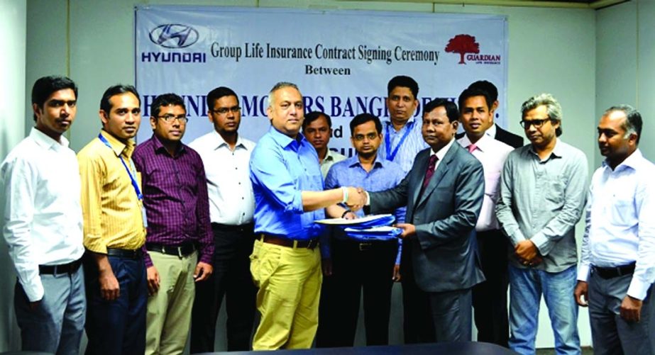 Shareq Fahim Huq, Managing Director of Hyundai Motors Bangladesh Ltd and Noor Mohammed Bhuiyan, Managing Director of Guardian Life Insurance Limited sign a contract for Group Life Insurance Coverage for their employees at their regional office recently.