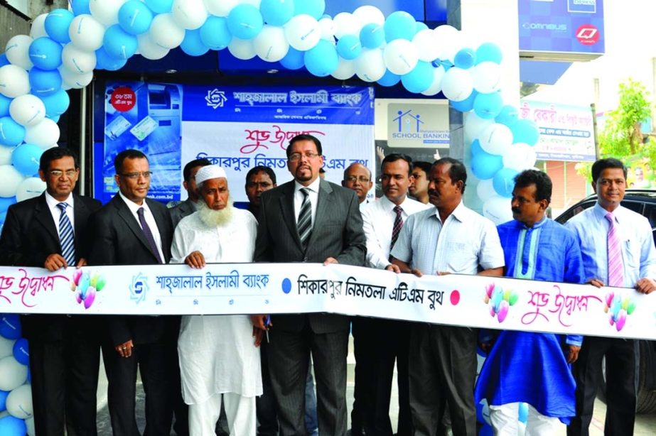 Farman R Chowdhury, Managing Director of Shahjalal Islami Bank Limited, inaugurating an ATM booth at Shikarpur Nimtola branch premises on Monday.