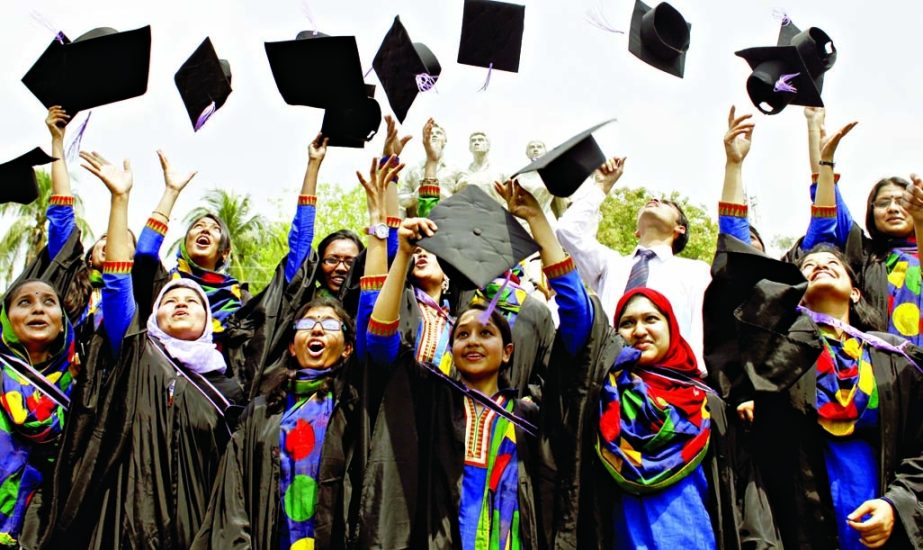 Jubilant recipients at 48th DU Convocation celebrating their academic feat by showing caps atop near TSC after receiving degrees on Monday.