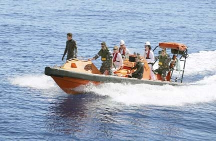 Australian Defense Force a fast response craft manned by members from the Australian Defense's ship Ocean Shield is deployed to scan the water for debris of missing Malaysia Airlines Flight 370 in the southern Indian Ocean. Up to 14 planes and as many sh