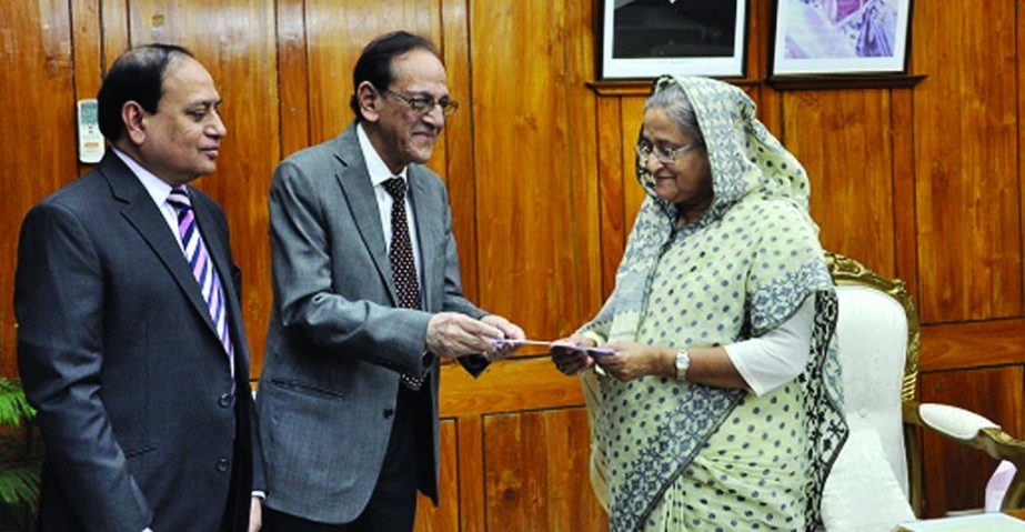 Prime Minister Sheikh Hasina receiving cheque of Tk 5million from ONE Bank's Vice Chairman Asoke Das Gupta and Managing Director M Fakhrul Alam for "Lakho Konthe Sonar Bangla"" fund recently."