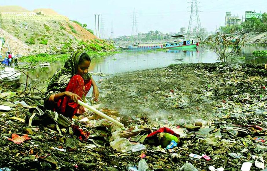 One may hardly believe that this is the once mighty 2nd Buriganga river now slowly going to be dead as piles of garbage dumped on the river bank is spreading and encroachers taking advantage to occupy the land under illegal occupation. This photo was take
