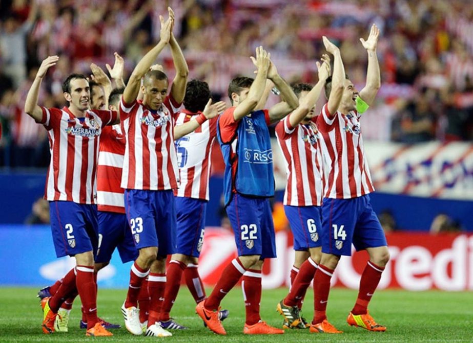 Atletico players celebrate at the end of the Champions League quarterfinal second leg soccer match between Atletico Madrid and FC Barcelona at the Vicente Calderon Stadium in Madrid, Spain. Atletico defeated Barcelona 1-0 on Wednesday.