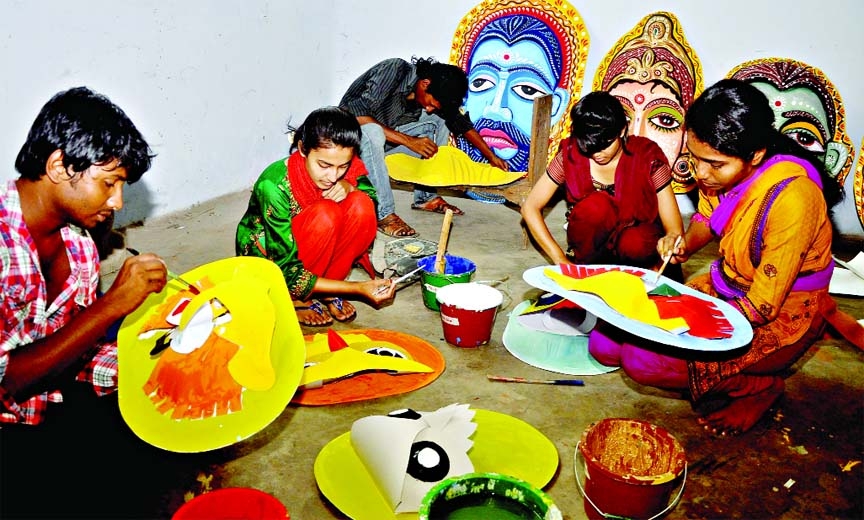 Ahead of Pahela Baishakh festival students of Institute of Fine Arts of Dhaka University making masks of various species for fan-fare. This photograph was taken on Thursday.