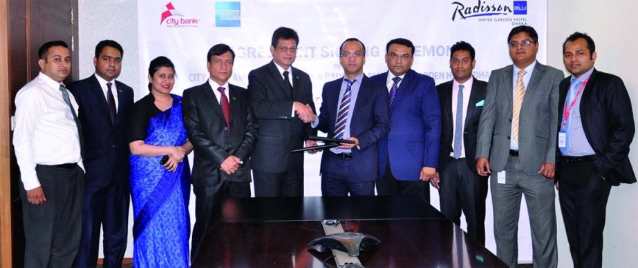 Deputy Managing Director and Chief Operating Officer of City Bank Mashrur Arefin and Radission Blu, Dhaka's EAM and Director, Sales & Marketing Saeed Ahmed sign an agreement to facilitate City Bank American Express Platinum and Gold Card members for enjo