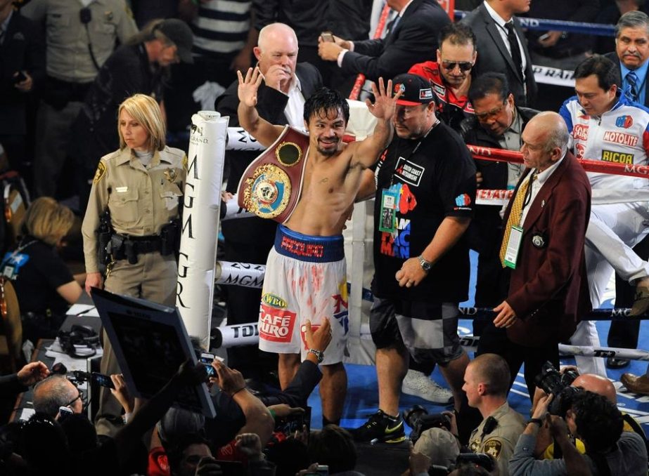 Manny Pacquiao celebrates after his unanimous decision victory over Timothy Bradley during their WBO world welterweight championship boxing match at the MGM Grand Garden Arena in Las Vegas, Nevada on Saturday.