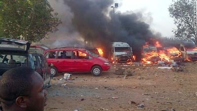 Vehicles are on fire after an explosion Monday, April 14, at a bus station on the outskirts of Abuja, Nigeria. At least 71 people were killed and 124 injured when a parked vehicle exploded at the Nyanya Motor Park bus station, Nigerian officials said.