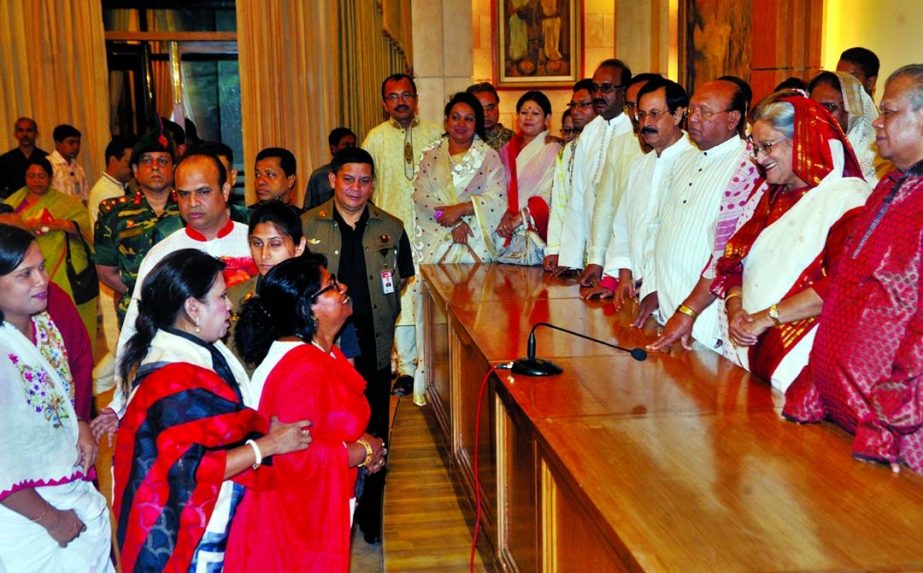 Prime Minister Sheikh Hasina exchanging pleasantries with the people on Pahela Baishakh at Ganobhaban in the city on Monday.