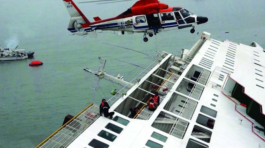 Passengers from a ferry sinking off South Korea's southern coast, are rescued by a South Korean Coast Guard helicopter in the water off the southern coast near Jindo, south of Seoul on Wednesday. Nearly 300 people were still missing Wednesday several hou