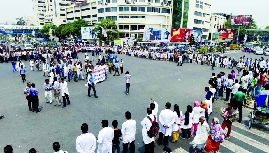 Striking doctors, nurses and employees of BIRDEM Hospital demonstrating at Shahbagh Square for the second day on Wednesday protesting assault on hospital staff by the relatives of a patient who died last Monday allegedly due to wrong treatment.