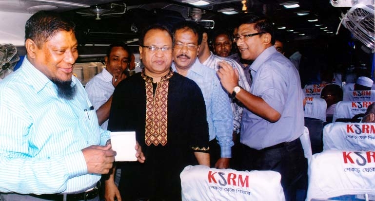 Mohammad Mokbul Ahmed, Manager of Railway Eastern Zone exchanging greetings with the train passengers of Subrana Express at Chittagong on the occasion of Bengali New Year on Monday.