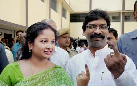 Jharkhand CM Hemant Soren and his wife show ink marked finger after casting their vote for Lok Sabha election in Ranchi.