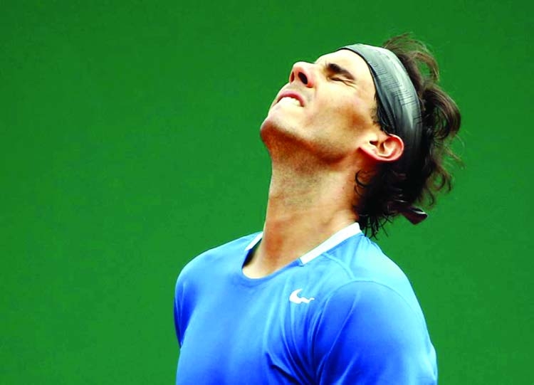 Rafael Nadal of Spain reacts after losing a point against David Ferrer of Spain during their quarterfinals match of the Monte Carlo Tennis Masters tournament in Monaco on Friday. Ferrer won 7-6 6-4.