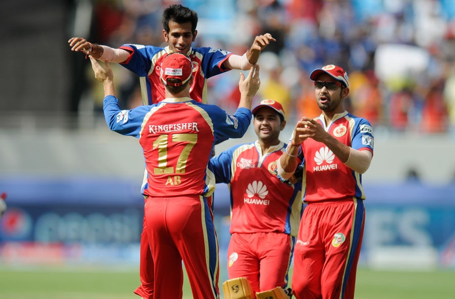 Yuzvendra Chahal is congratulated after taking a wicket during Indian Premier League between Royal Challengers Bangalore and Mumbai Indians at Dubai on Saturday.